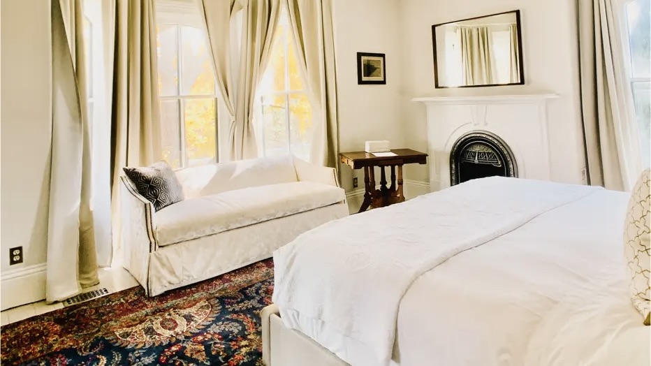Woodbourne Inn bedroom with fireplace at one of the best boutique hotels in Niagara on the lake