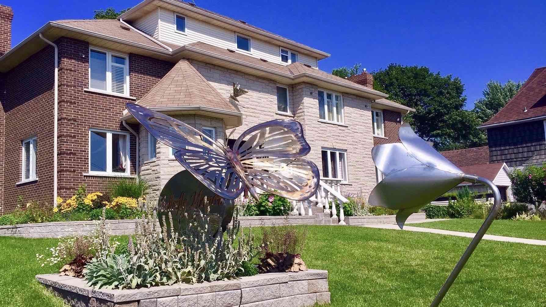 butterfly-manor exterior with butterfly sculpture